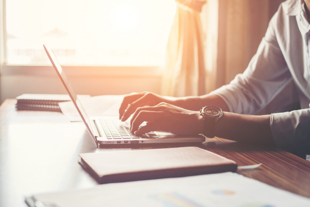 close-up-male-hands-using-laptop-home